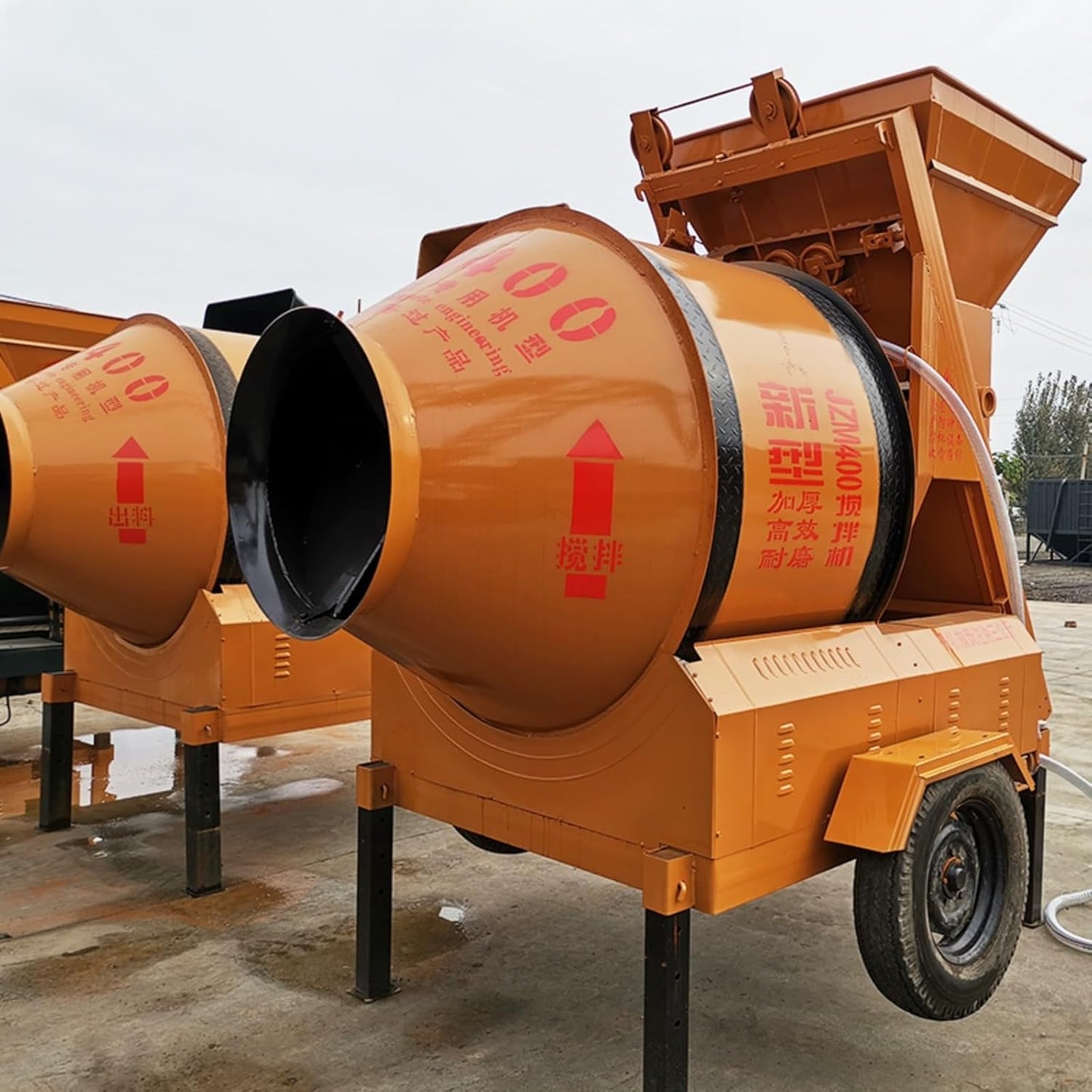 Mobile Concrete Mixers with Drum and Discharge Chute for Ready-Mix Concrete Applications and Mixing Materials on Industrial Sites, Construction Projects and in Remote Locations